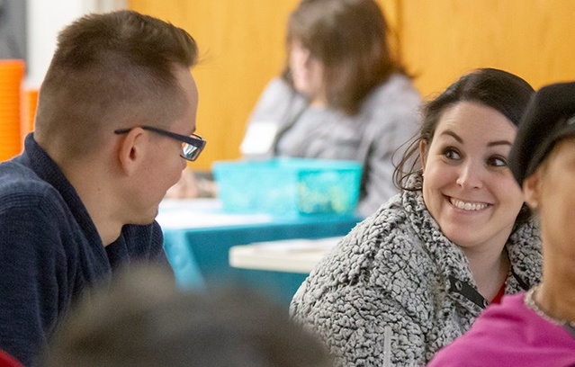 DRO VOCA Attorney Sarah Hill smiles at DRO VOCA Advocate Basil Stolar at the OVWA training