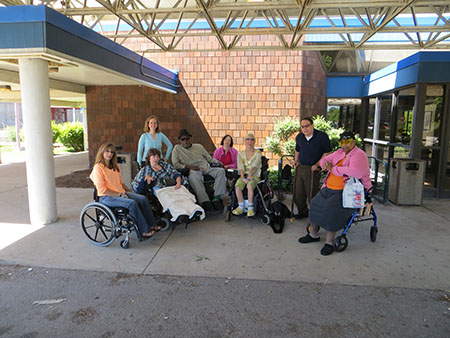 Staff from Services for Independent Living of Ohio, Inc., gather outside the Cleveland Amtrak station before investigating the accessibility of the facility.