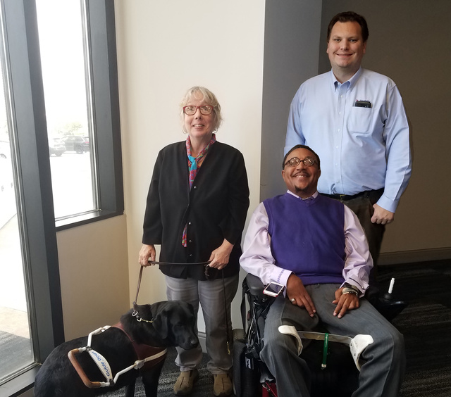 DRO attorney Barb Corner and her service dog, Maybelle, DRO client and Board member Donzel Shepherd and DRO attorney William Puckett 