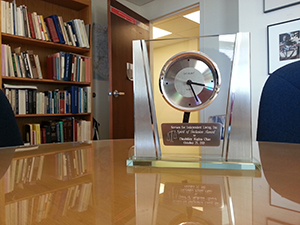 DRO's Spirit of Inclusion Award from Services for Independent Living is displayed on a desk.